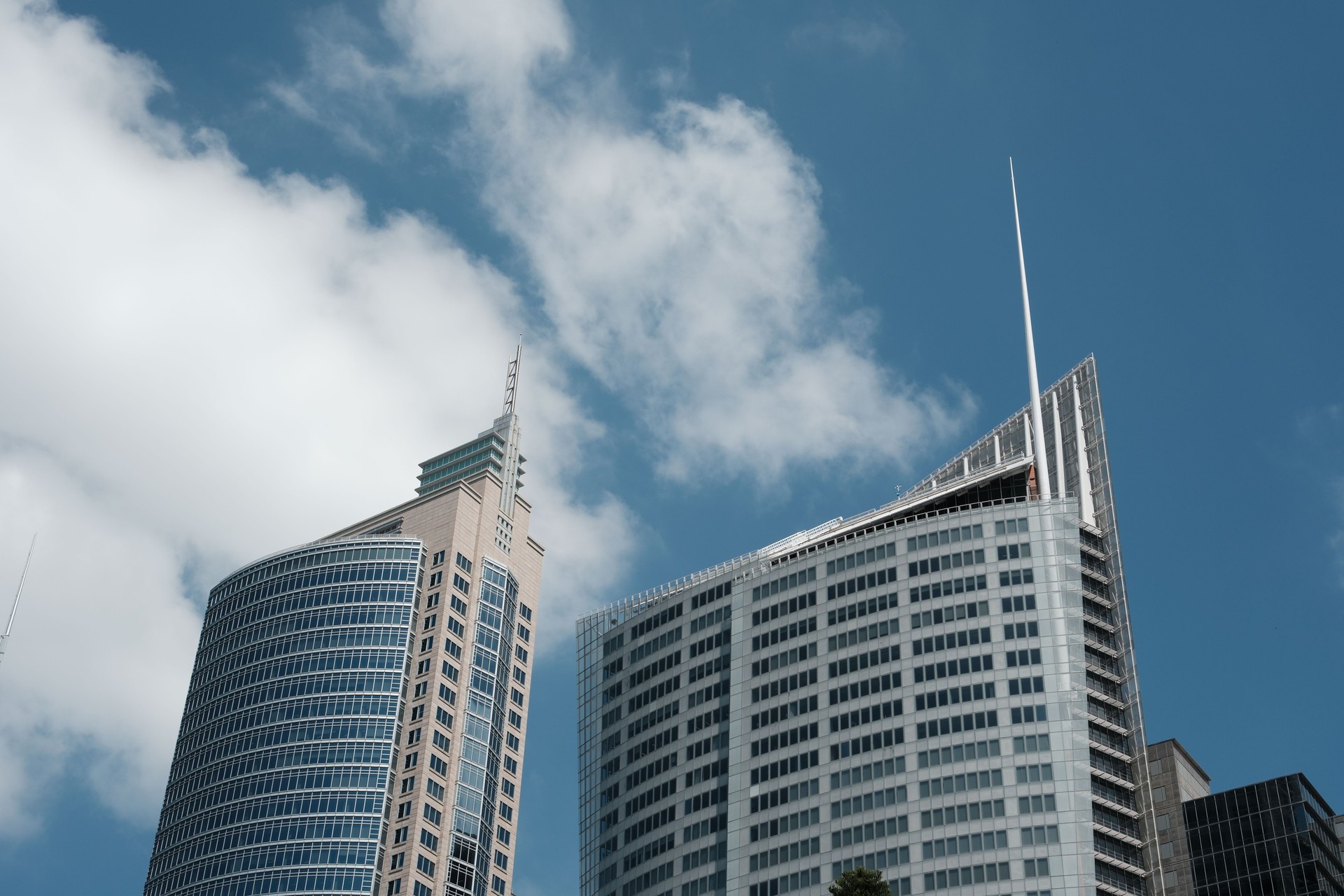 Two tall modern office buildings