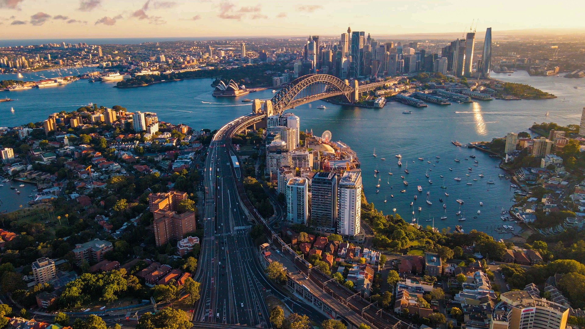 Aerial drone view of Sydney City and Sydney Harbour showing Sydney Harbour Bridge and Lavender Bay, NSW in the late afternoon